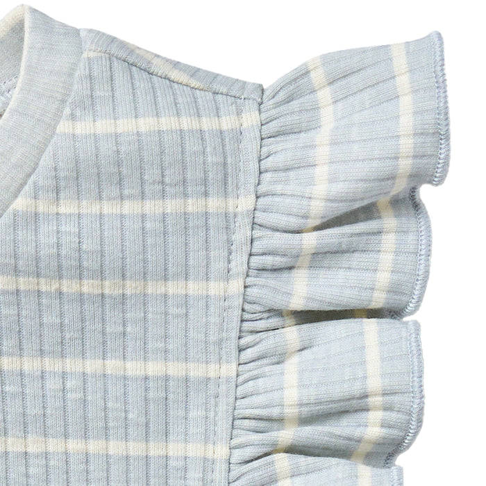 Close-up of a light blue and white striped fabric with ruffled edges on a white background