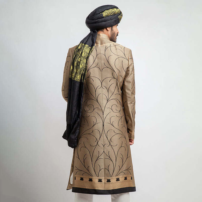 Antique gold and black brocade form-fitted sherwani with intricate embroidery, combining luxurious design and a modern tailored fit.