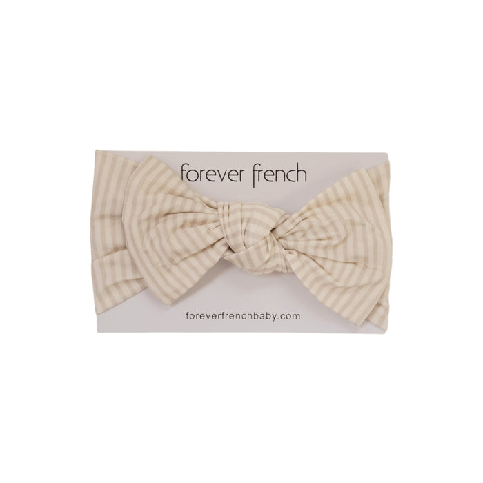 The Bamboo Head Wrap | Teddy by forever french baby, featuring beige and white stripes, is displayed on a white card with "forever french baby" and "foreverfrenchbaby.com" printed above and below the headband.