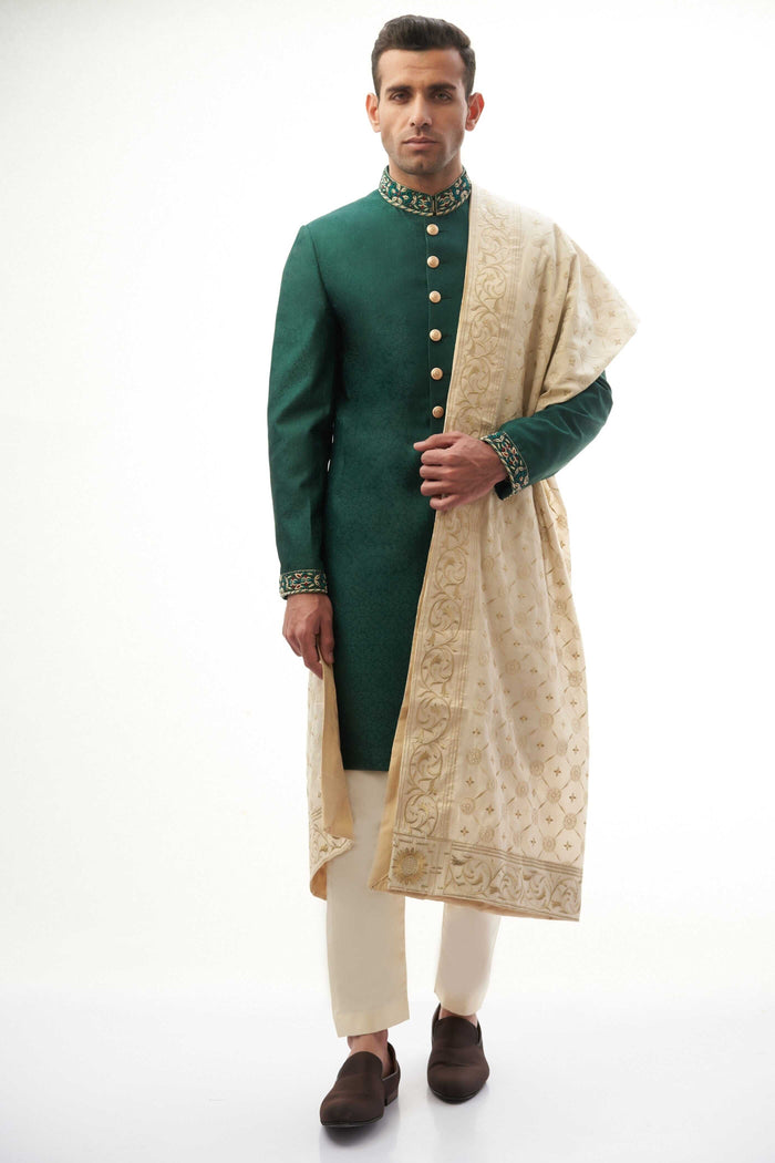 Emerald Green Brocade Silk Sherwani with Handcrafted Zardozi – Elegant and luxurious with intricate zardozi embroidery.