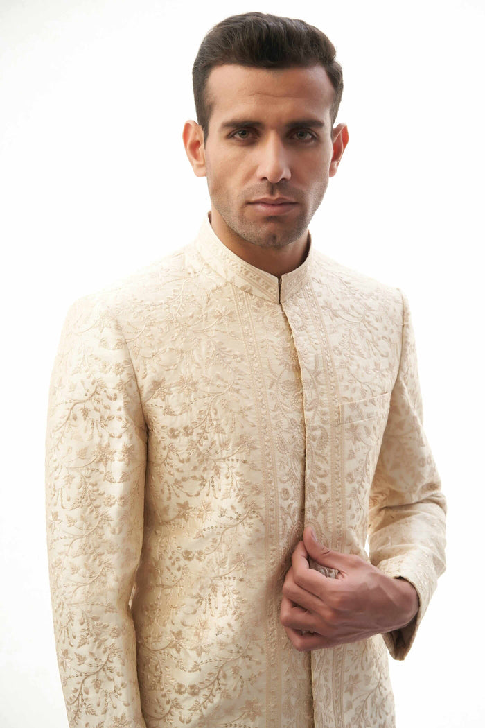 Fawn Persian Painting-Inspired Sherwani – Exquisite fawn-colored sherwani with intricate Persian painting-inspired embroidery for a royal look.