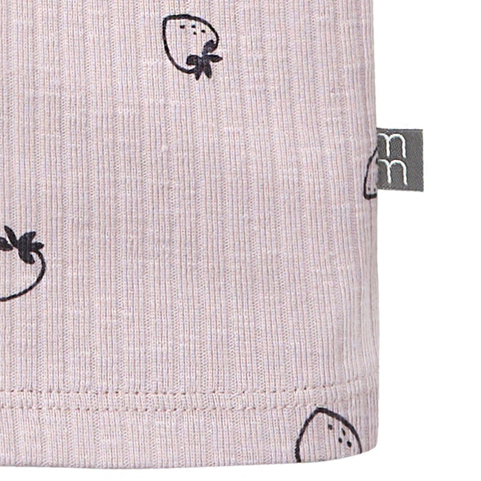 Close-up of a fabric with black strawberry pattern and a visible brand tag on a light gray background.