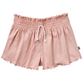 Pink shorts with a drawstring on a white background