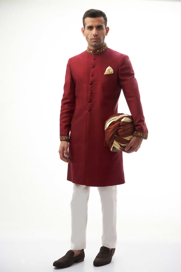 Maroon Brocade Silk Sherwani with Handcrafted Zardozi – Elegant maroon silk sherwani featuring intricate zardozi embroidery for a royal touch.
