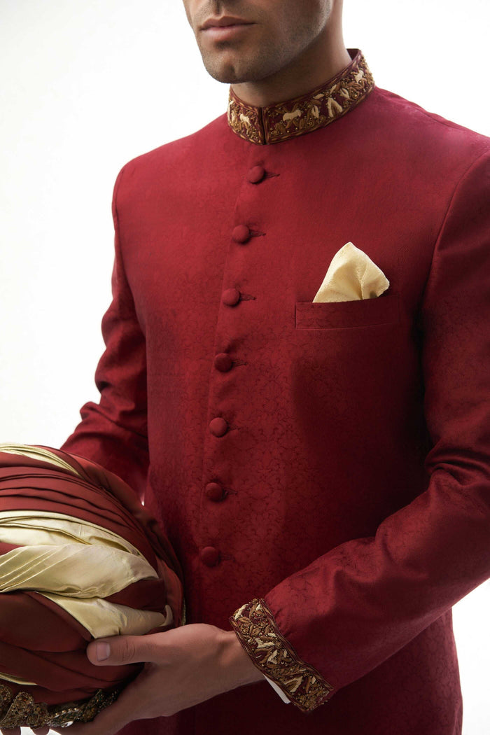 Maroon Brocade Silk Sherwani with Handcrafted Zardozi – Elegant maroon silk sherwani featuring intricate zardozi embroidery for a royal touch.