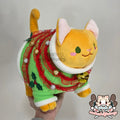 Orange fat cat in a sweater