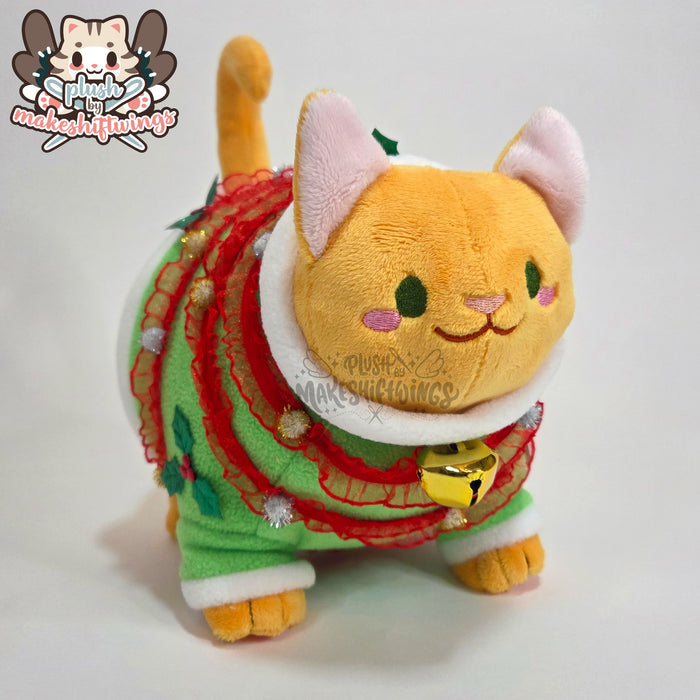 Orange fat cat in a sweater