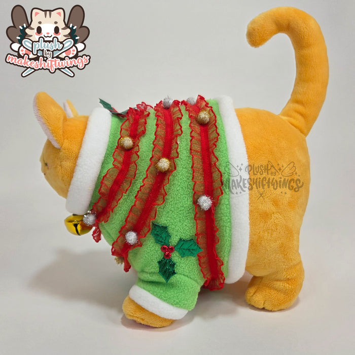 Orange fat cat in a sweater