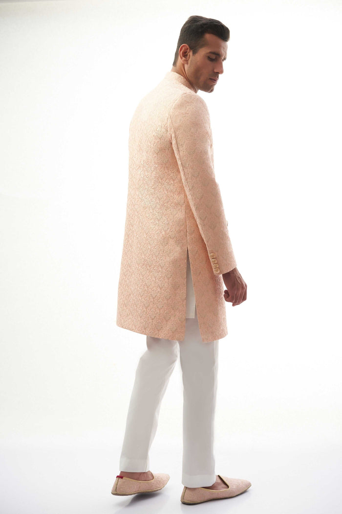 Peach Rawsilk Sherwani with All-Over Intricate Embroidery, Perfect for Traditional and Wedding Occasions.