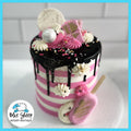 Pink and white striped buttercream birthday cake