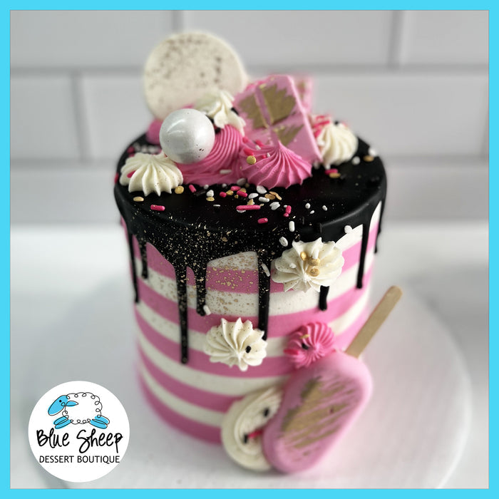 Pink and white striped buttercream birthday cake
