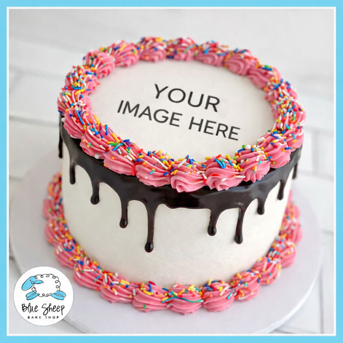 Custom edible image birthday drip cake with chocolate drip, pink buttercream borders, and sprinkles from Blue Sheep Bake Shop in Somerville NJ
