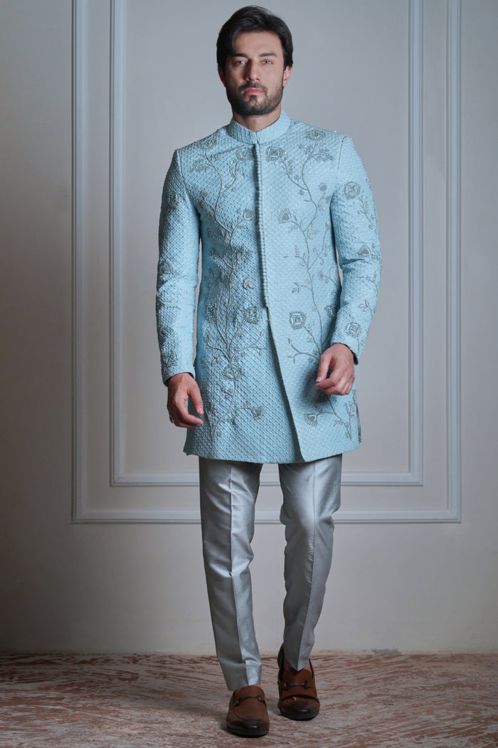 Ice blue rawsilk zardozi sherwani by Arsalan Iqbal featuring intricate hand embroidery and a regal slim-fit silhouette for groom wear