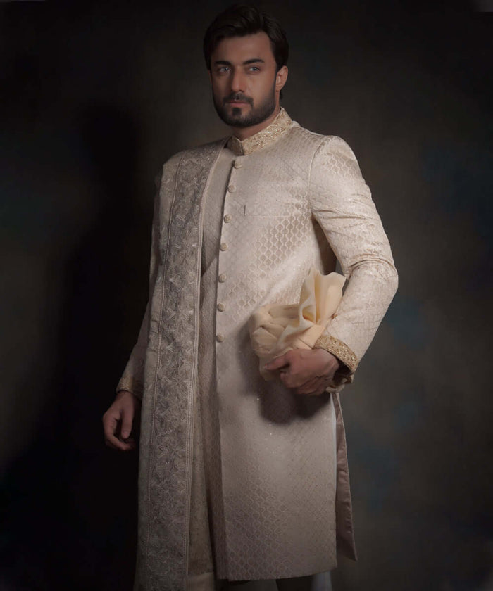 Pearl cream quilted sherwani with embroidered shawl and turban.