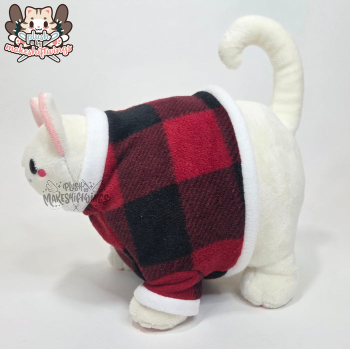 White fat cat in a sweater